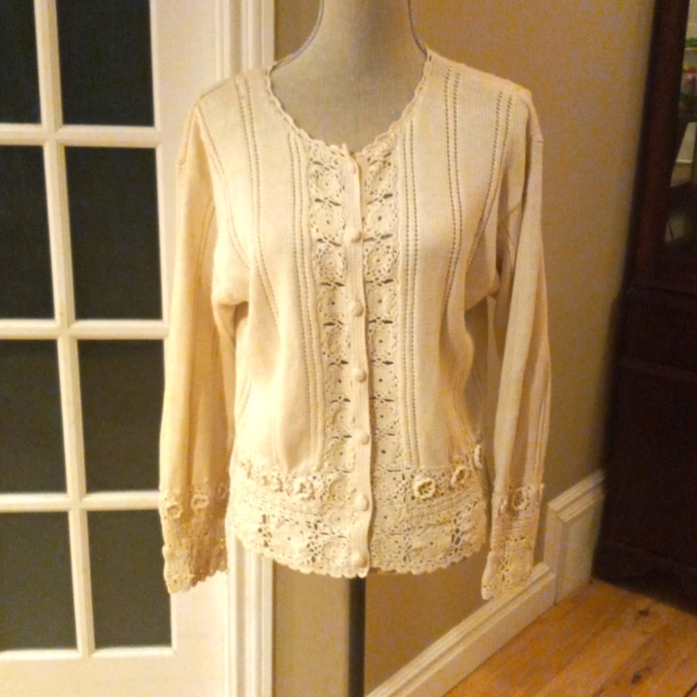 A soft cream, lacey sweater.button down front